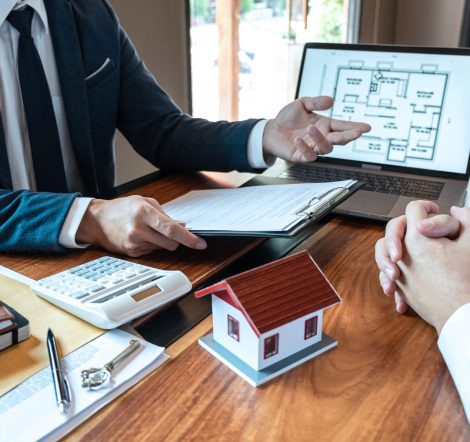 Real estate agent are presenting home loan and sending keys to customer after signing contract to buy house with approved property application form, Insurance Home concept.